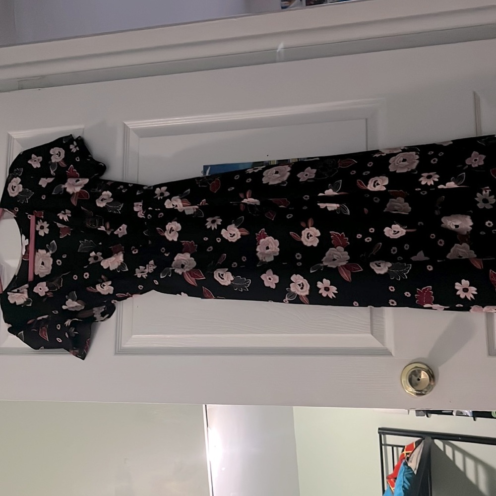 Dark floral romper dress with a high low style